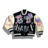 a black and pink varsity jacket with graffiti on it