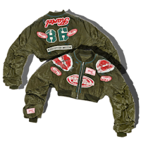 a green bomber jacket with patches on it