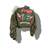 a green bomber jacket with a logo on it